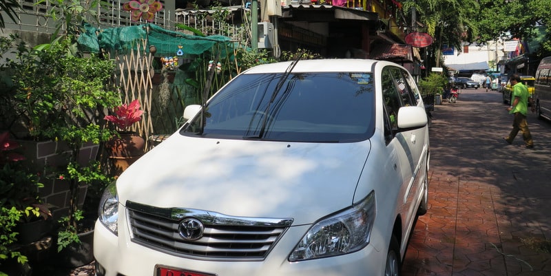 white innova car parked private transfers