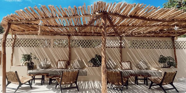 Cha Cha Beach Club Koh Mak tables chair sunlight bamboo roof